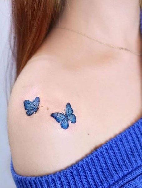 blue butterfly tattoo behind ear