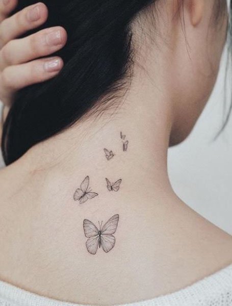 blue butterfly tattoo behind ear