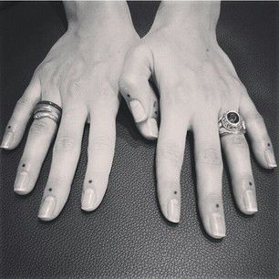 finger tattoo meanings dots