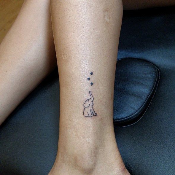 small elephant tattoo on hand