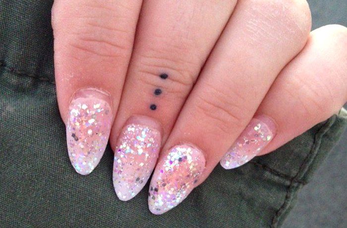 finger tattoo meanings dots