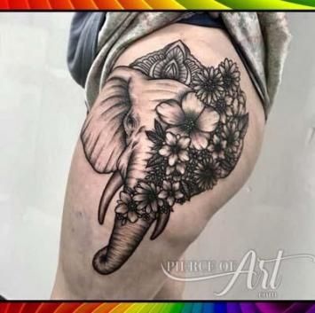 elephant head tattoo on thigh