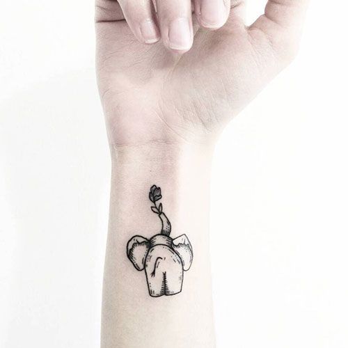 small elephant tattoo on hand