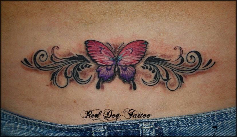 small butterfly tattoo lower back
