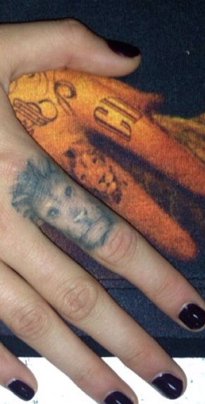 lion finger tattoo healed